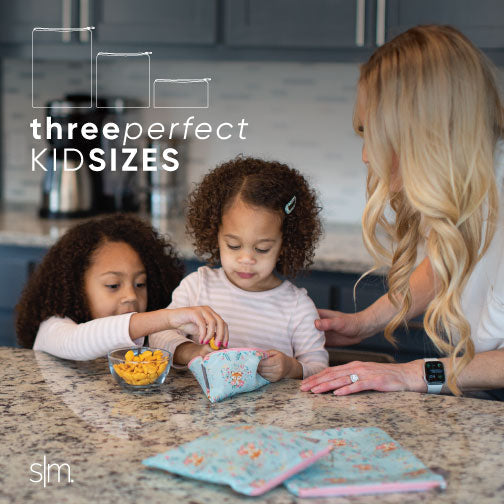 Ellie Snack Bag displayed on a kitchen countertop with light gray speckled surface, natural wood cabinetry, and warm neutral background tones