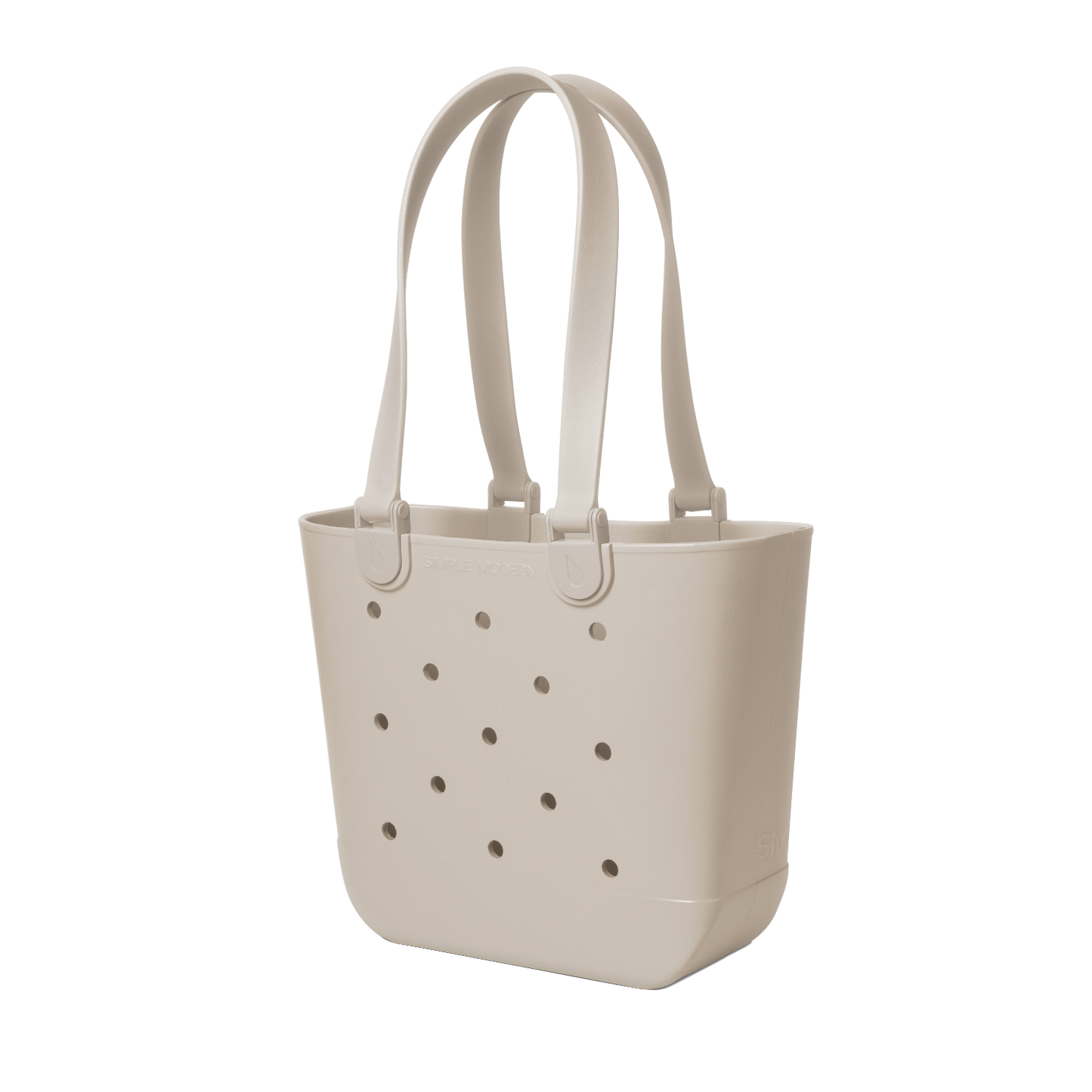 Cream-colored tote bag with handles and small circular perforations throughout the body, displayed on a neutral background.